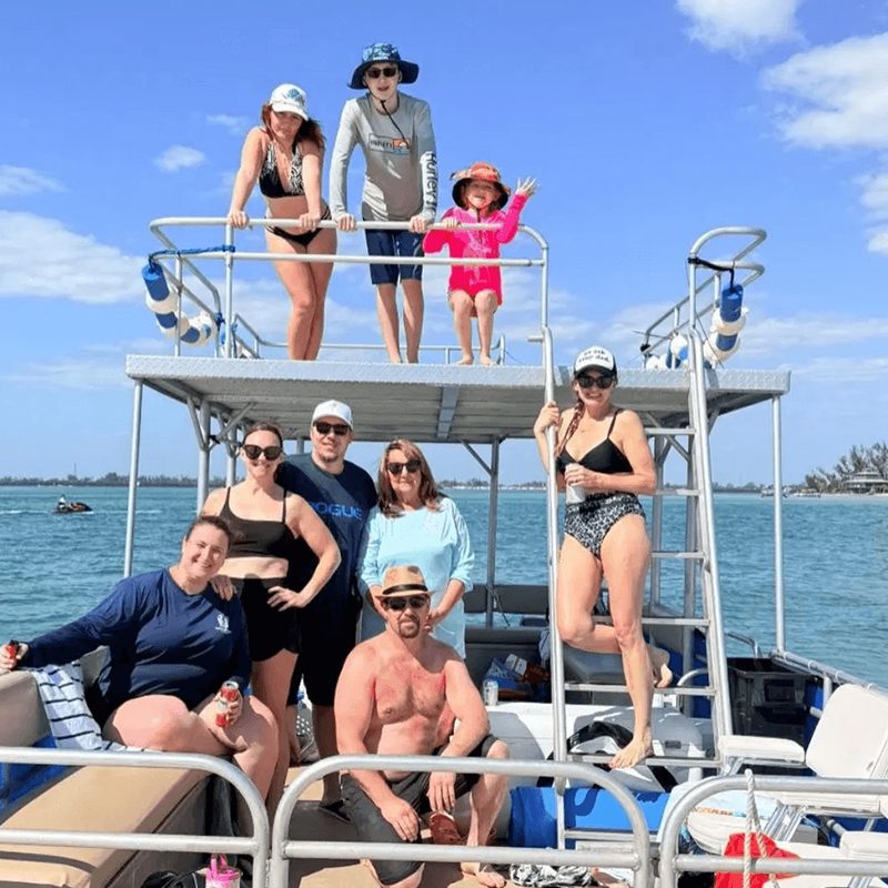 Group enjoying a sunny day on boat