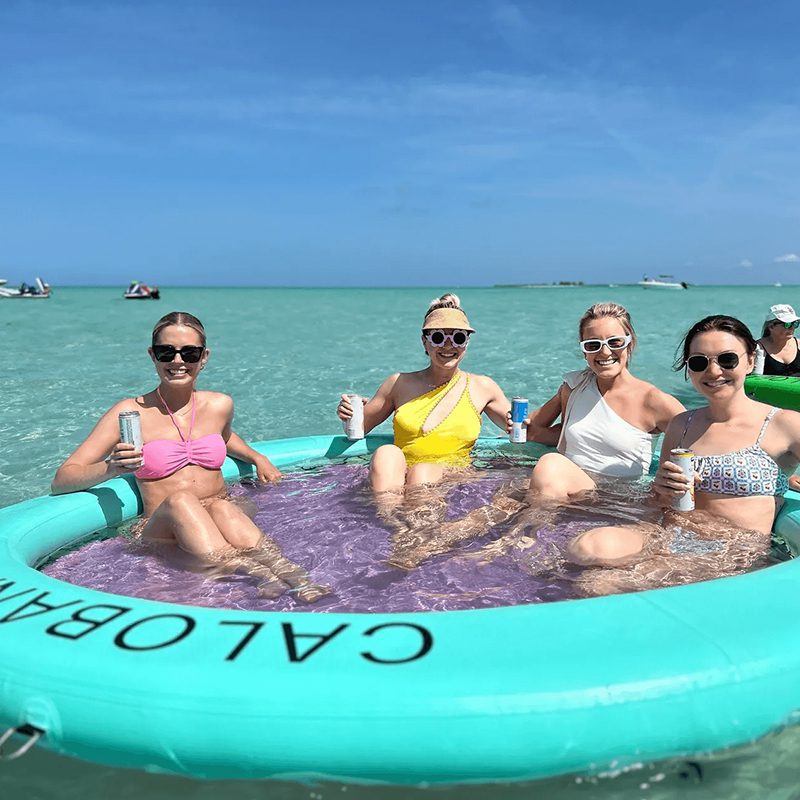 Group in inflatable pool on water