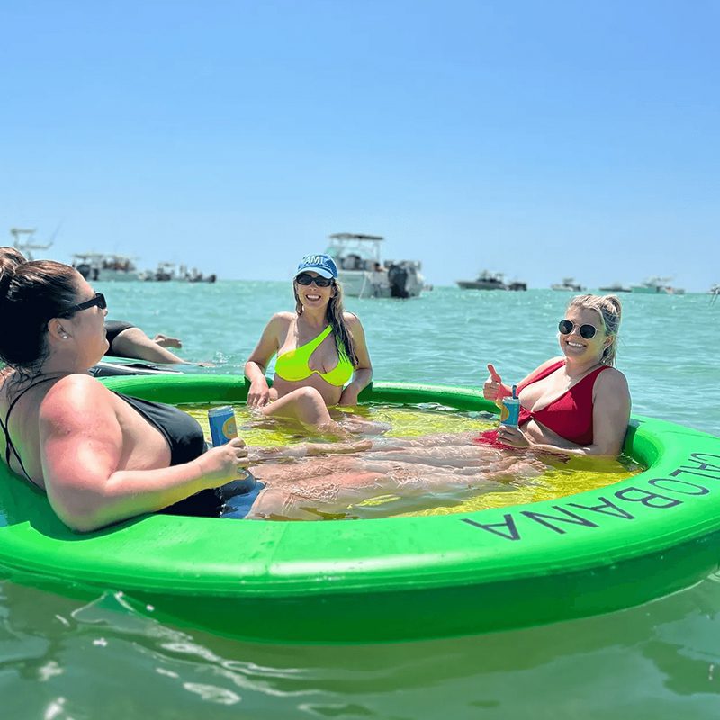 Women relaxing in inflatable float ring