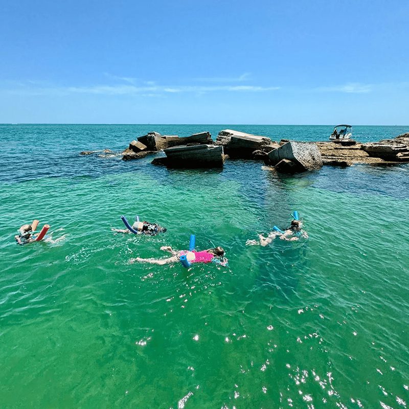 Snorkelers exploring vibrant turquoise waters