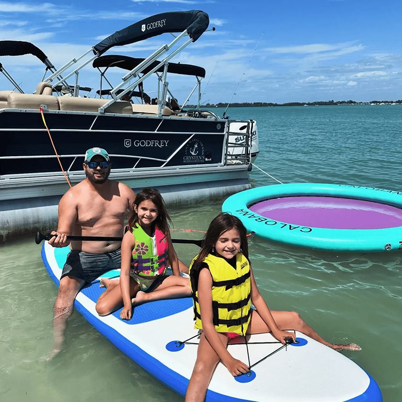 Man and kids enjoying sunny day on water