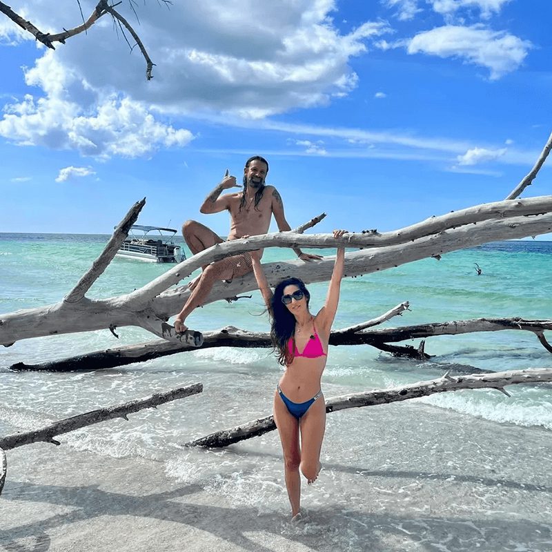 Relaxing on driftwood by the sea