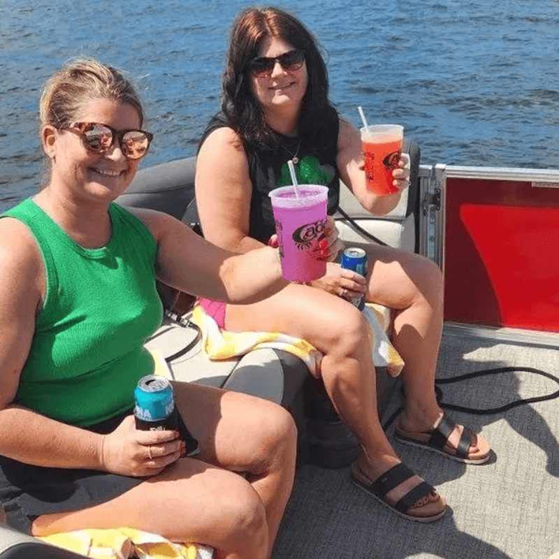 Women enjoying drinks on a boat