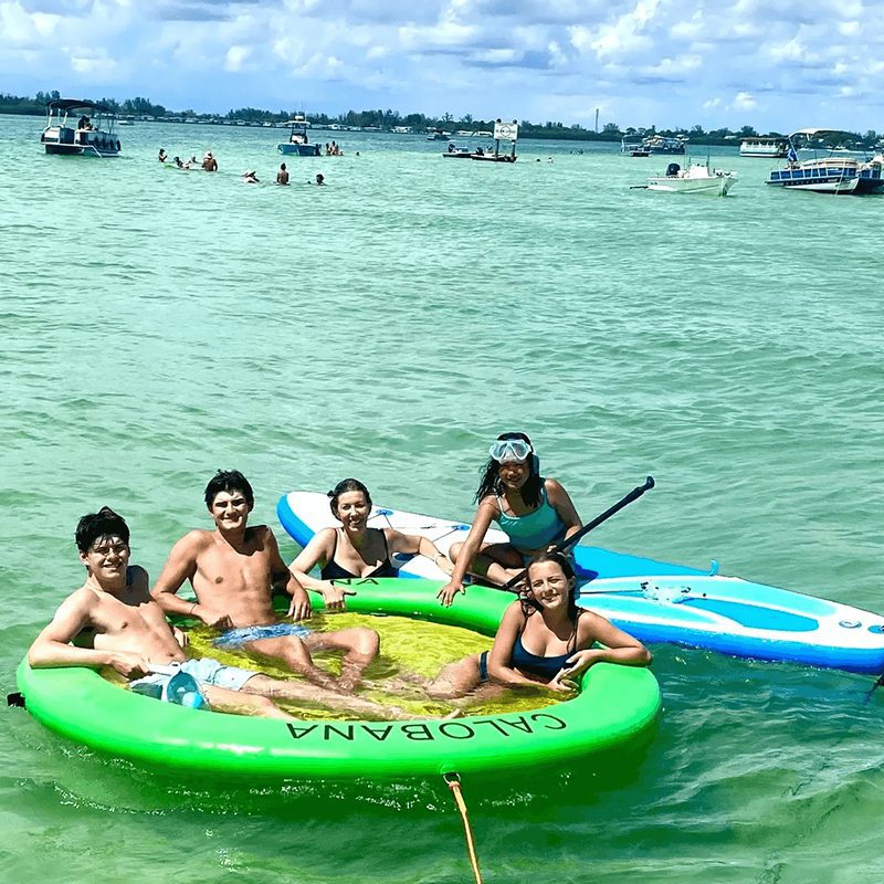 Happy people on inflatable rafts