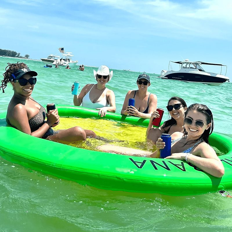 Group enjoying drinks on water float