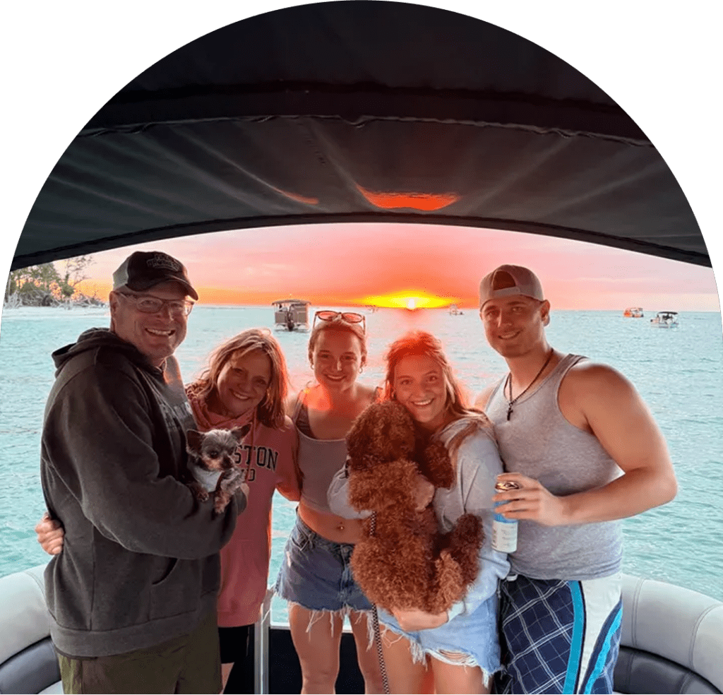 Family with dogs on a boat