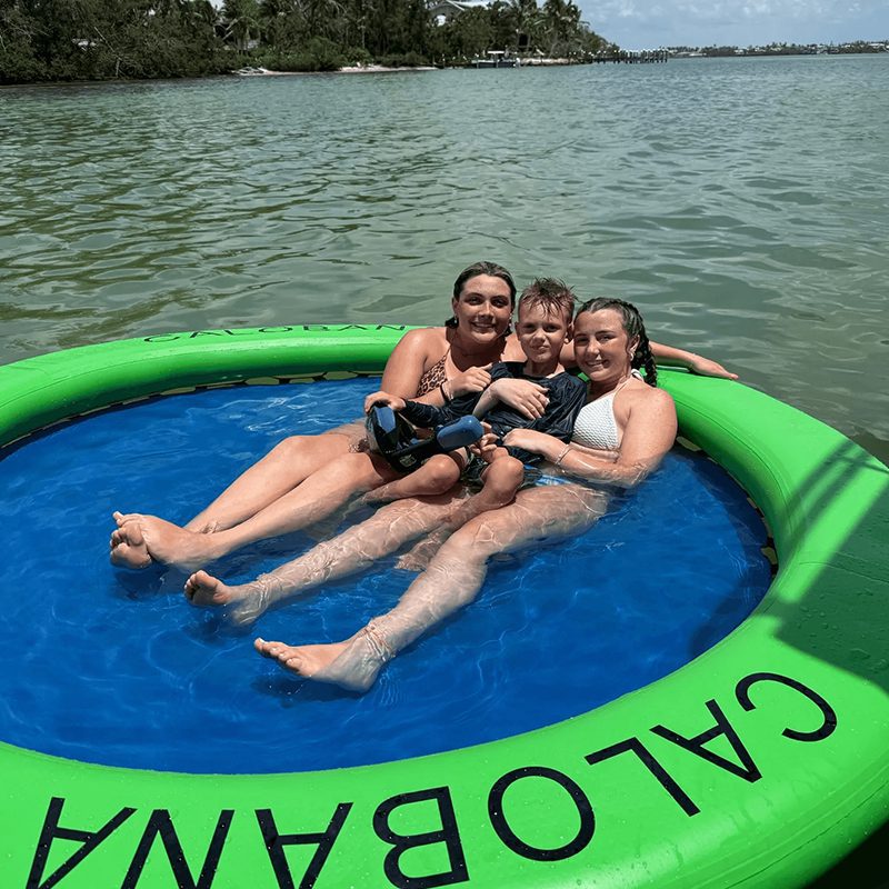 Group enjoying sunny day on lake
