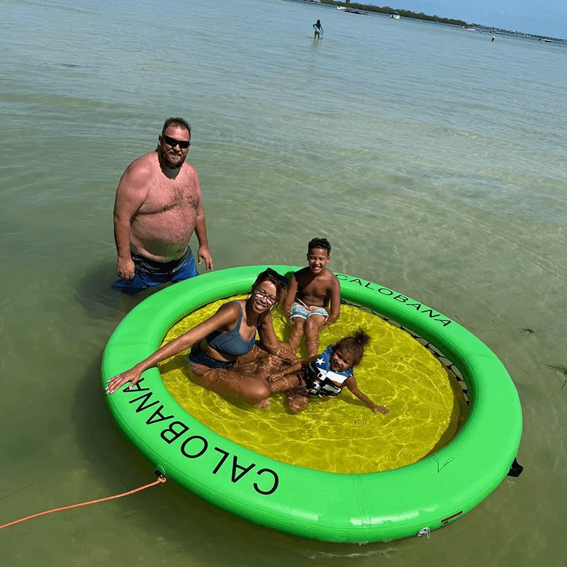 Group relaxing on green water float