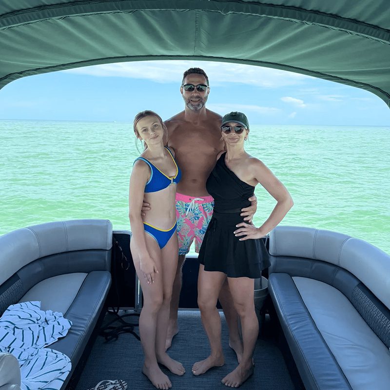Trio standing on a boat deck