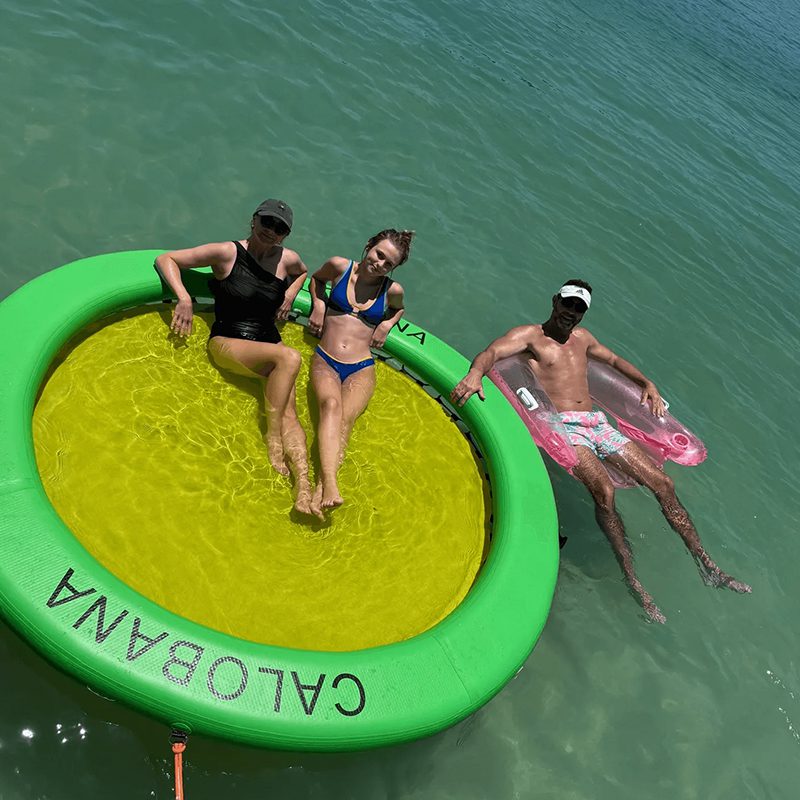 People relaxing on a floating raft