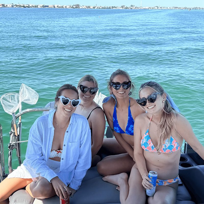 Friends enjoying a sunny boat day
