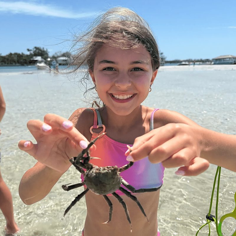 Young girl enjoying seaside adventure