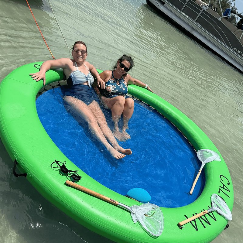 Floating in a green inflatable pool