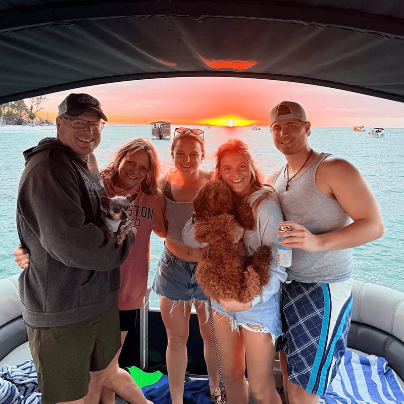 Group enjoying sunset on a boat