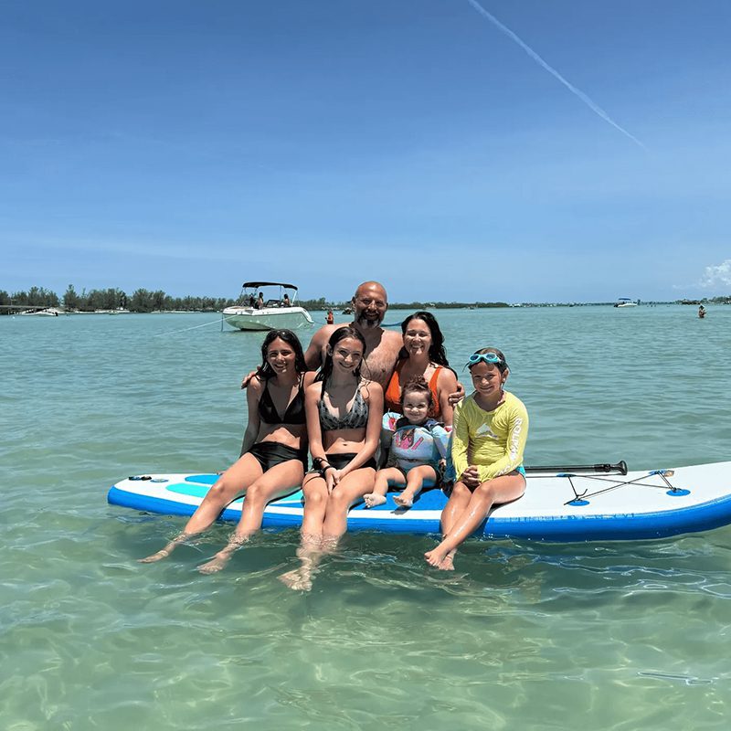 Smiling family on paddleboard adventure
