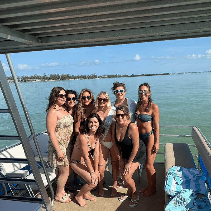 Women posing on a boat deck
