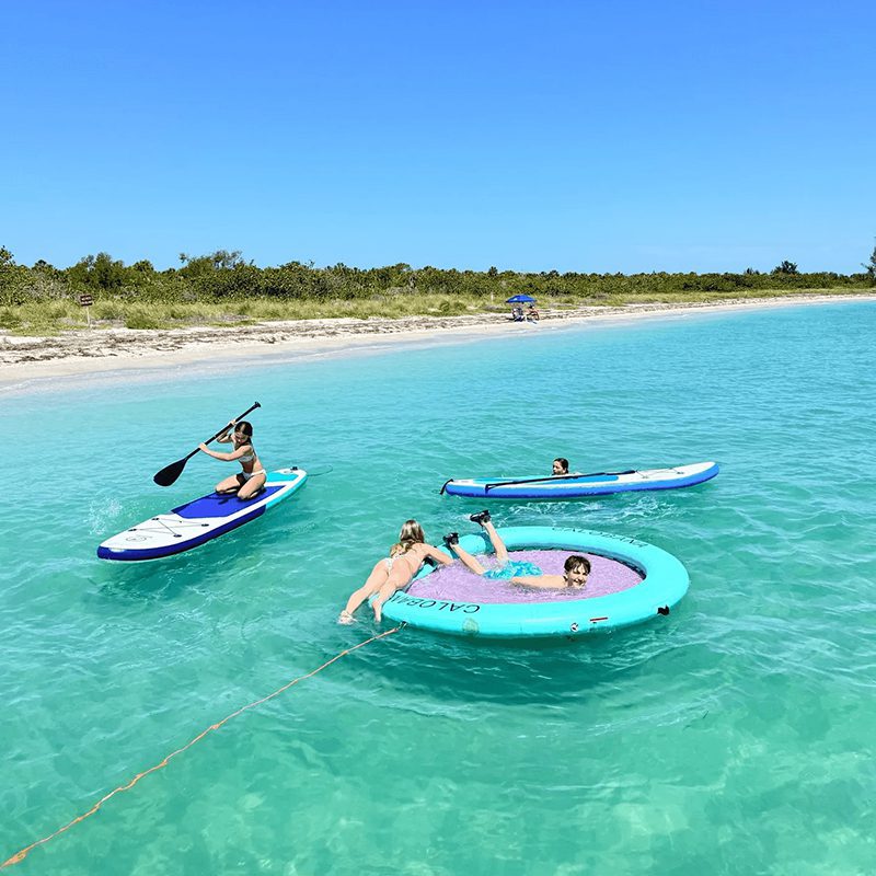 Friends having fun in turquoise ocean water