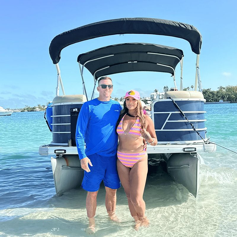 Relaxing by a boat on the shore