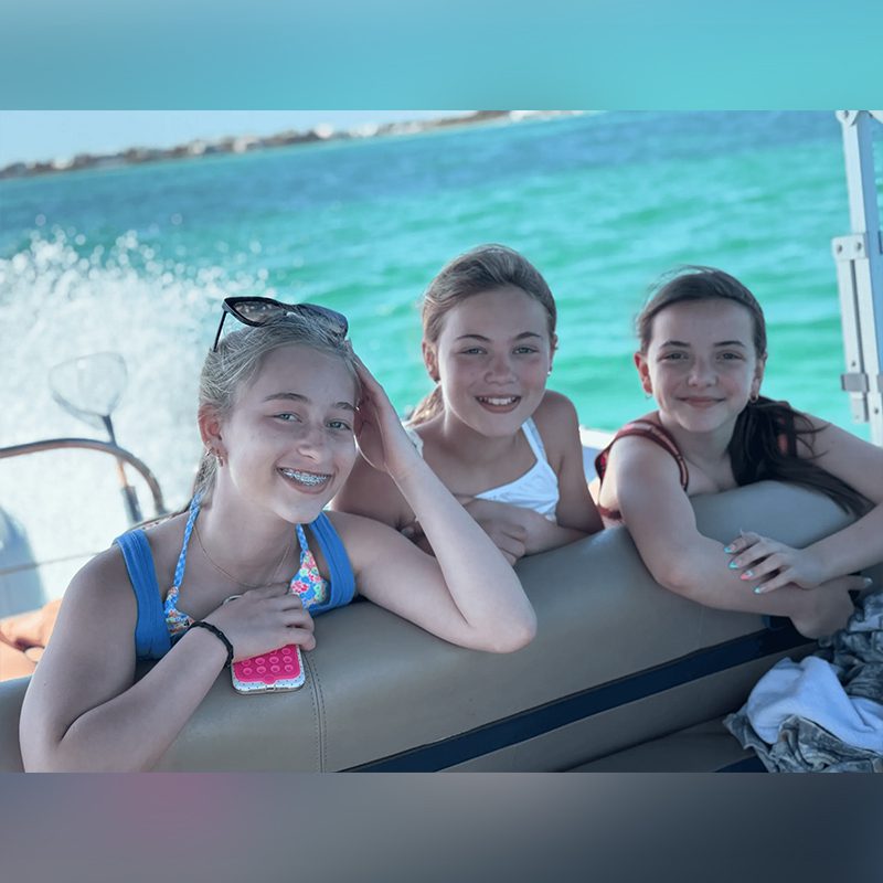 Friends enjoying a sunny boat ride