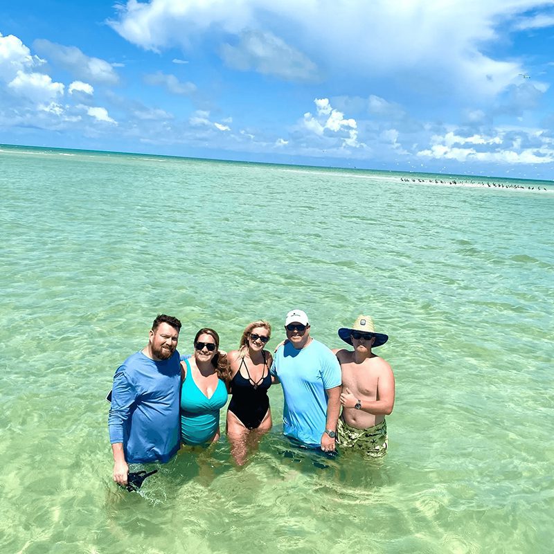 People relaxing in tropical sea setting