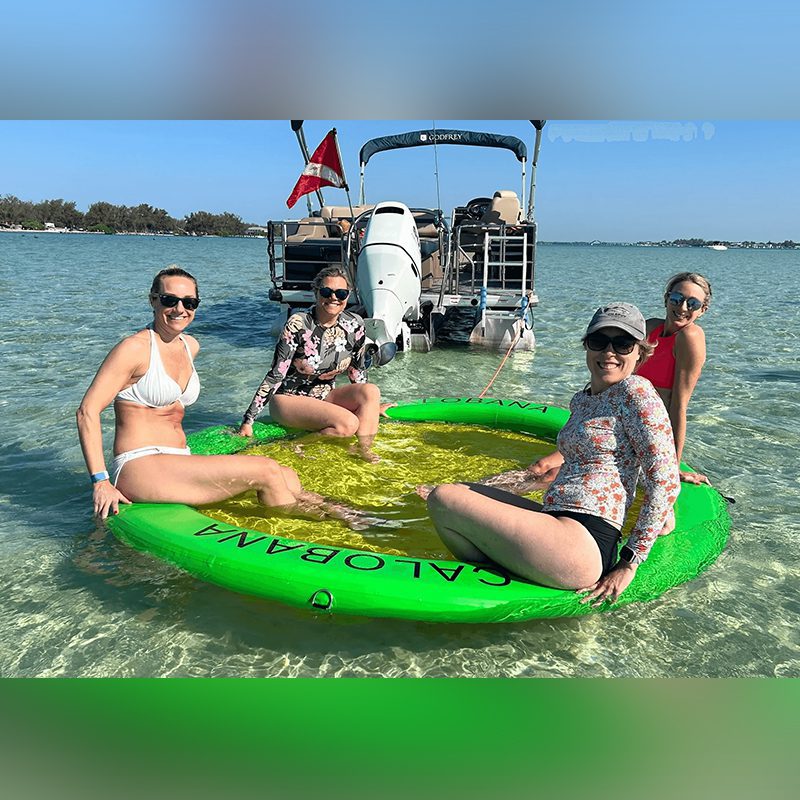 Women relaxing on inflatable raft