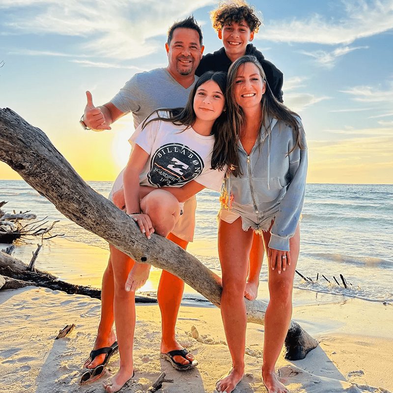 Smiling group by the ocean shore