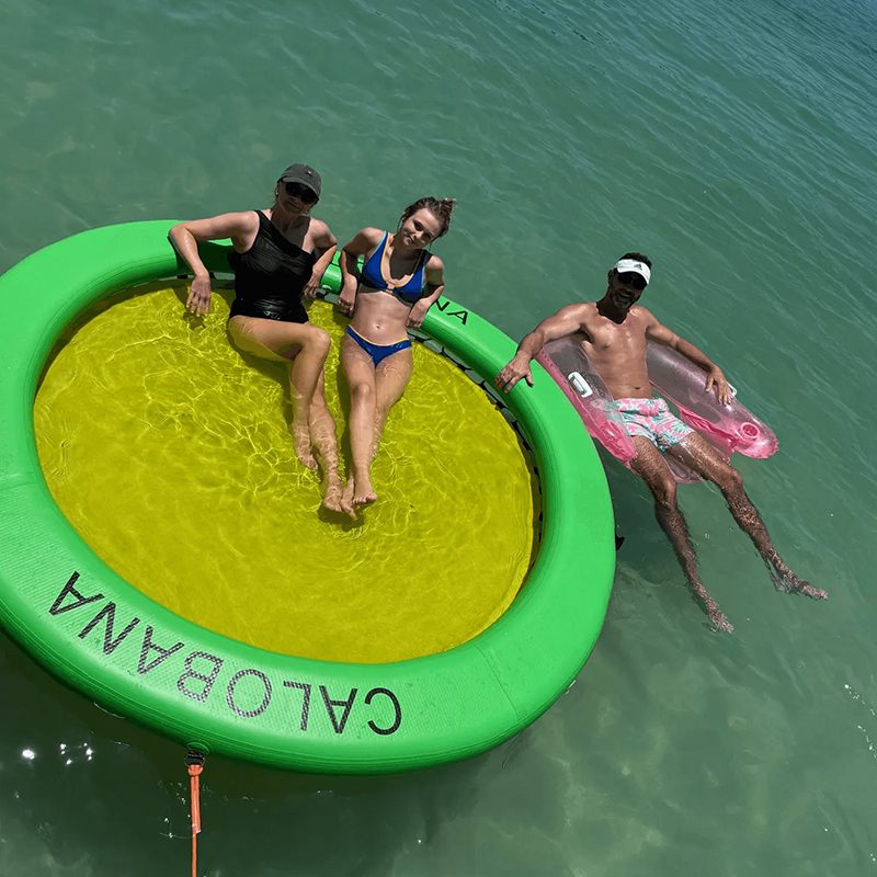 People relaxing on water inflatables