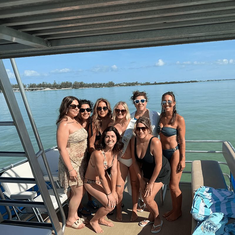 Smiling women posing on deck