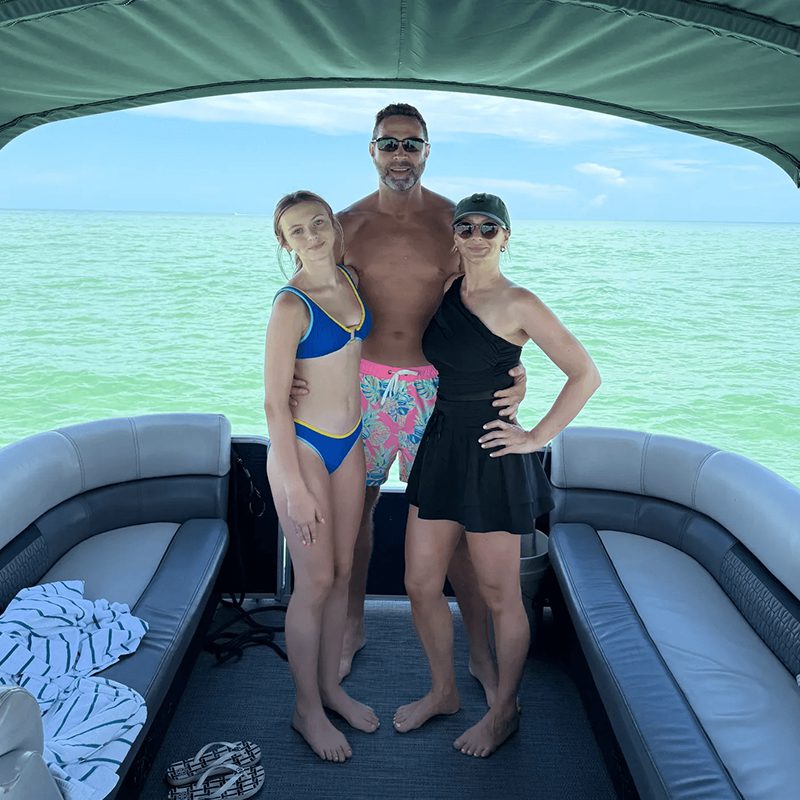 Group posing on a boat