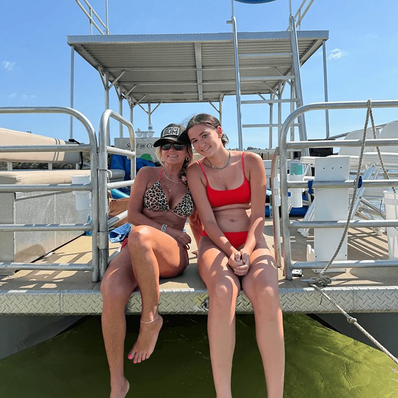Two women sitting on a boat