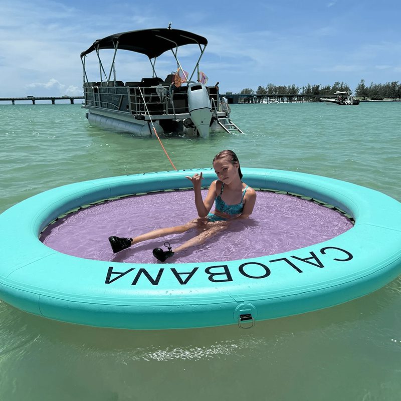 Child on inflatable ring in the sea