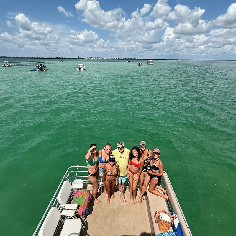Friends posing on a boat deck