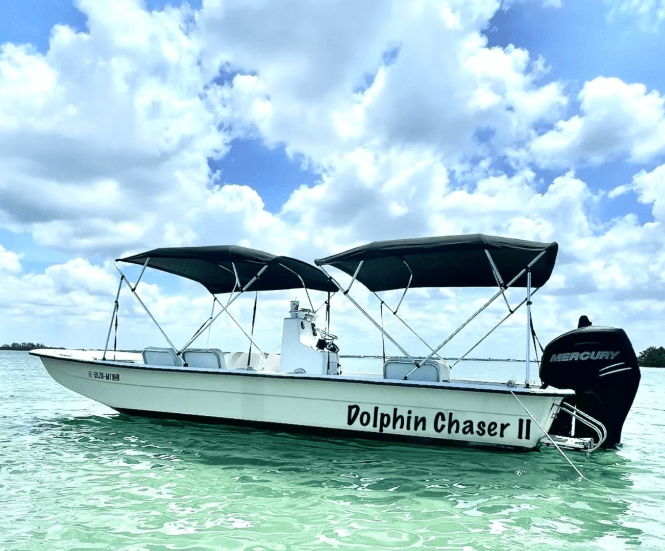 White Dolphin Chaser II boat on turquoise water