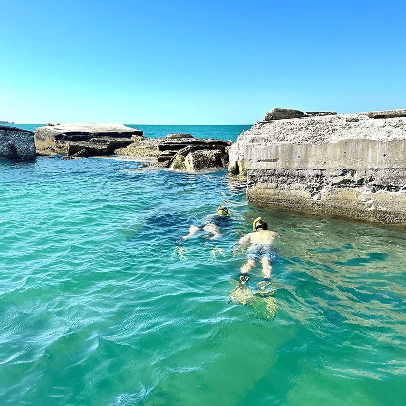 Snorkelers exploring clear turquoise water