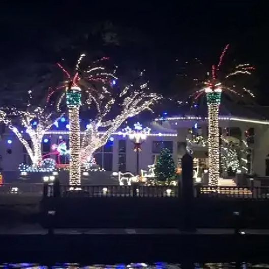 Nighttime display of Christmas decorations and lights